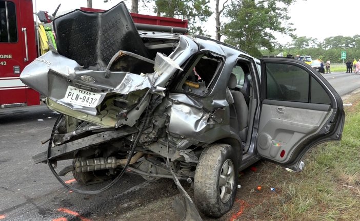 MOTHER DEAD -TWO CHILDREN EJECTED AFTER CAR HITS TWO 18 WHEELERS